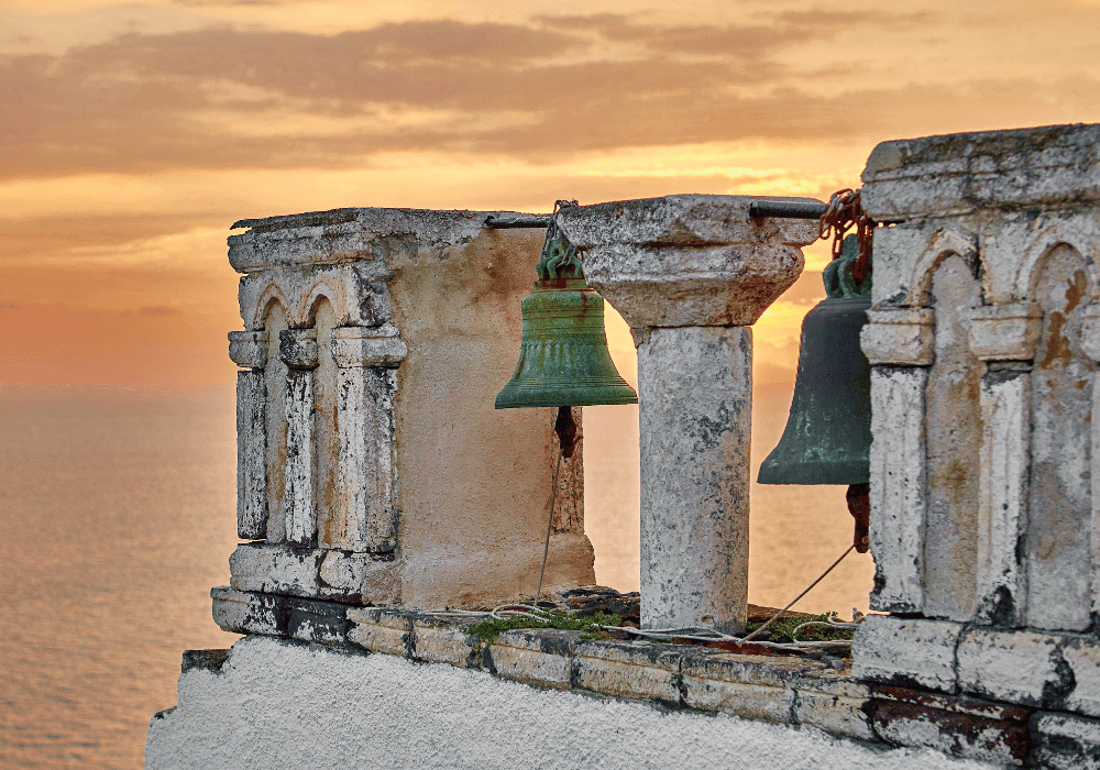 Bells in Santorini, overlooking the serene ocean during Greek Easter celebrations