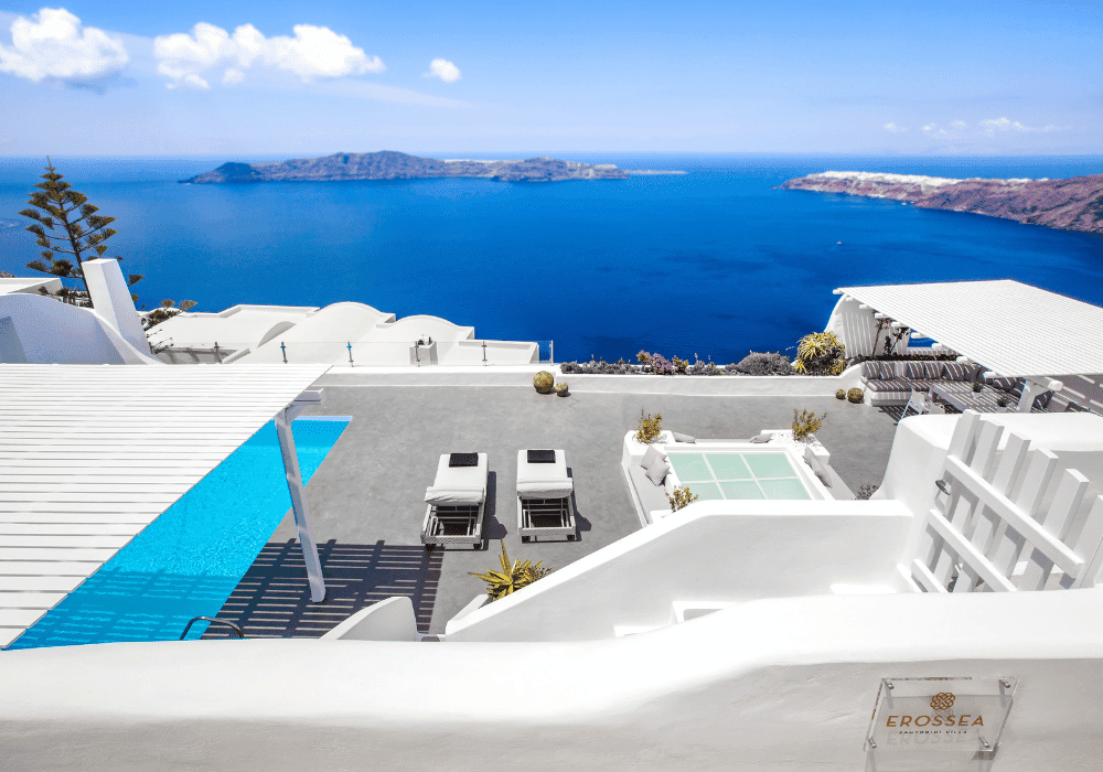 A vibrant blue sky with wispy white clouds, embodying the beauty of Erossea Villa Santorini during the celebration of Greek Easter