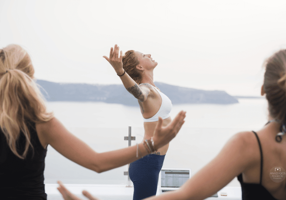 Peaceful yoga retreat in Santorini, Greece, featuring the stunning Erossea Villa amidst picturesque landscapes